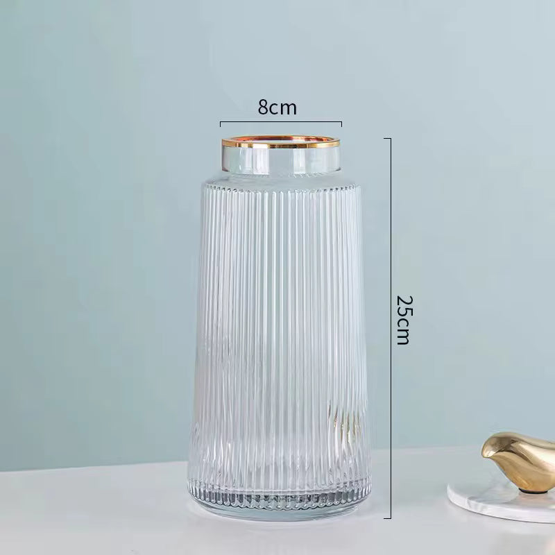 Clear glass vase with gold rim and measurements on a light blue background