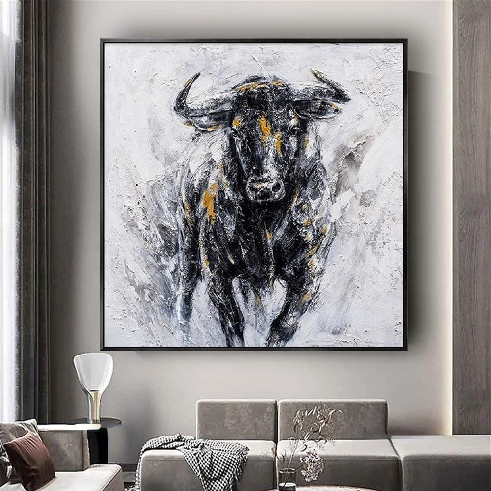 Abstract painting of a bull on a wall in a living room setting