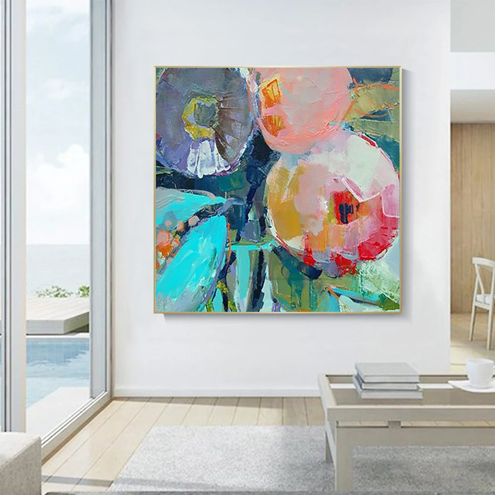 Abstract painting in a modern living room with a view of the ocean.