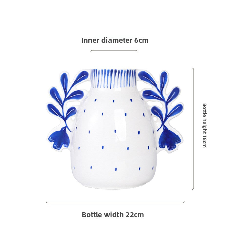 White bottle with blue floral designs and measurements on a white background