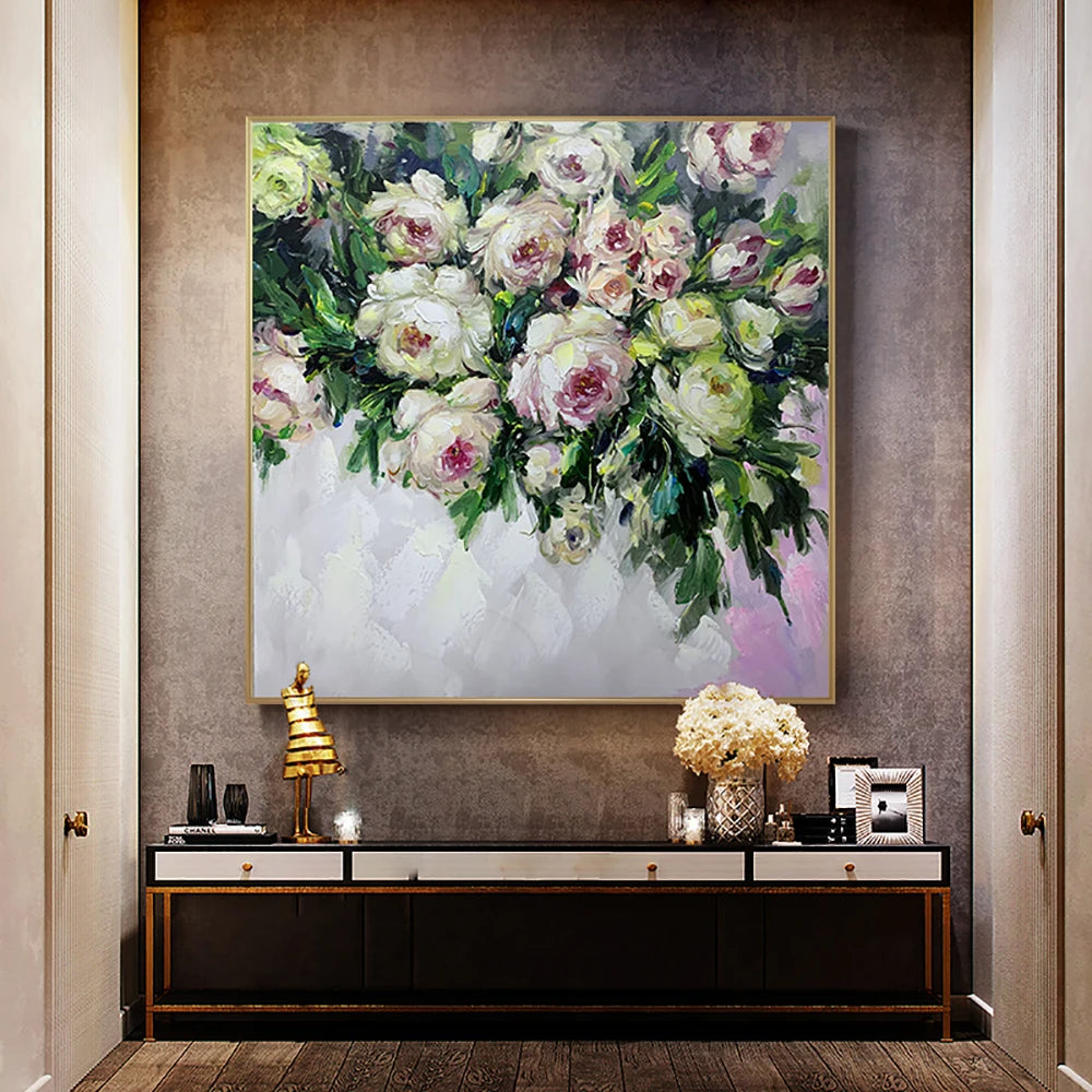 Floral painting on a wall above a console table with decorative items.