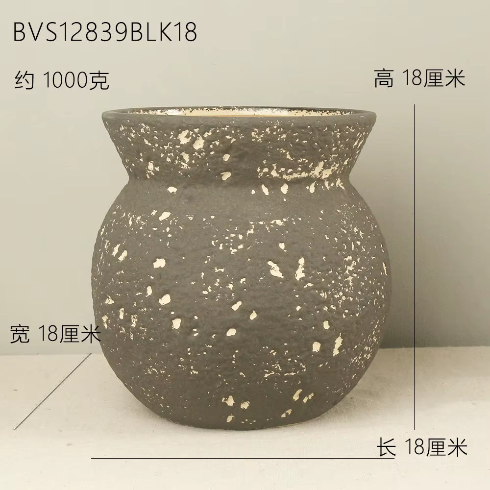 Speckled gray vase on a light background with dimensions indicated