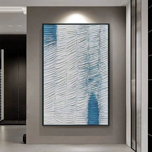 Abstract art piece with blue and white patterns in a modern interior setting