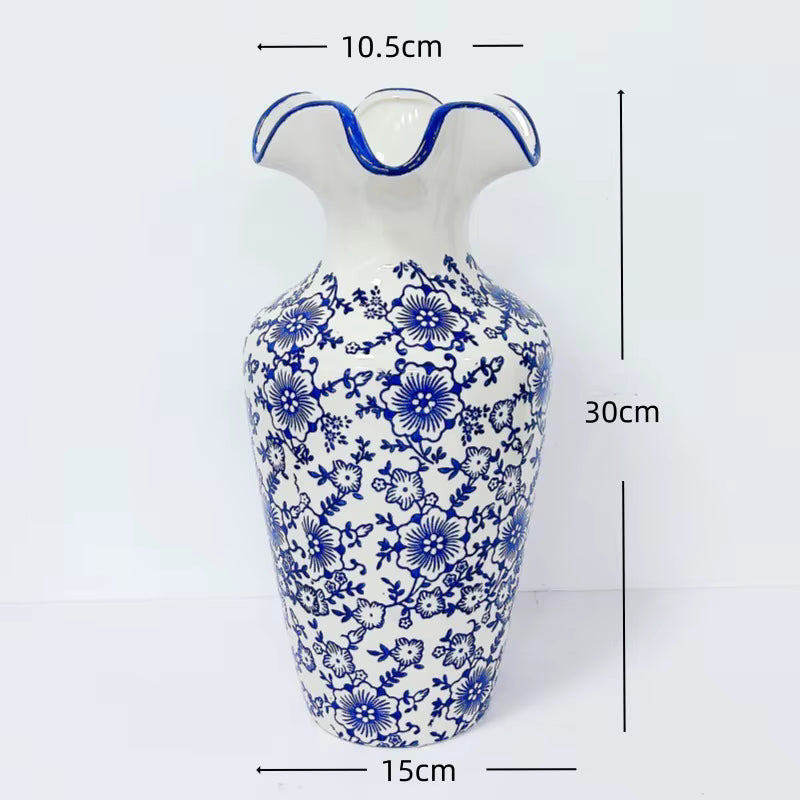 White vase with blue floral patterns and measurements on a white background