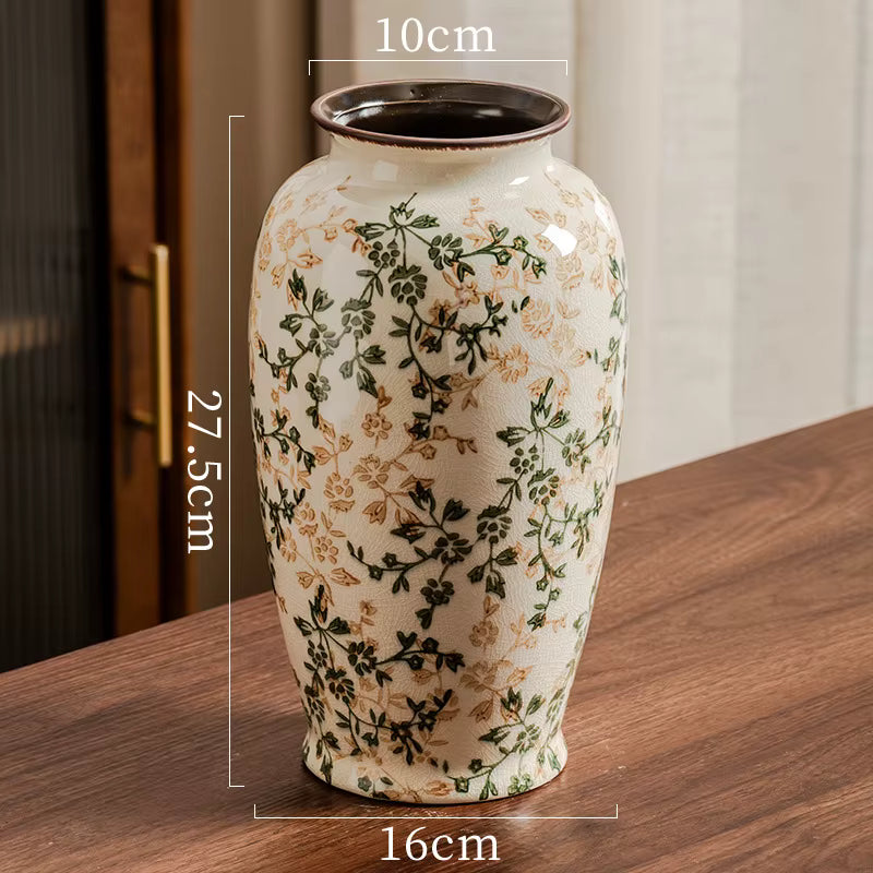 Decorative vase with floral patterns on a wooden surface, showing measurements.