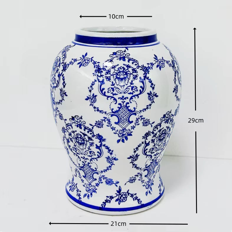 Blue and white ceramic vase with intricate patterns and measurements on a white background