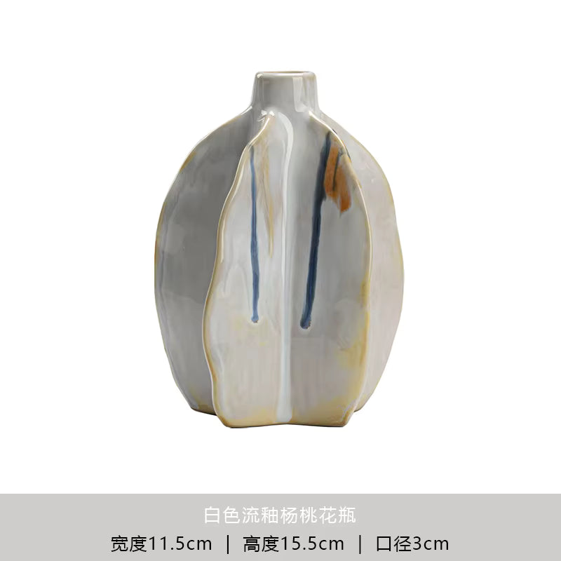 Ceramic vase with abstract design on a white background