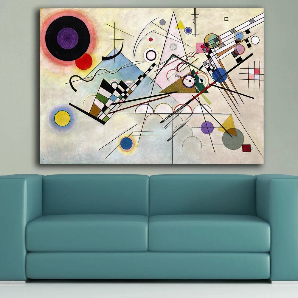 Abstract artwork on a wall above a teal sofa