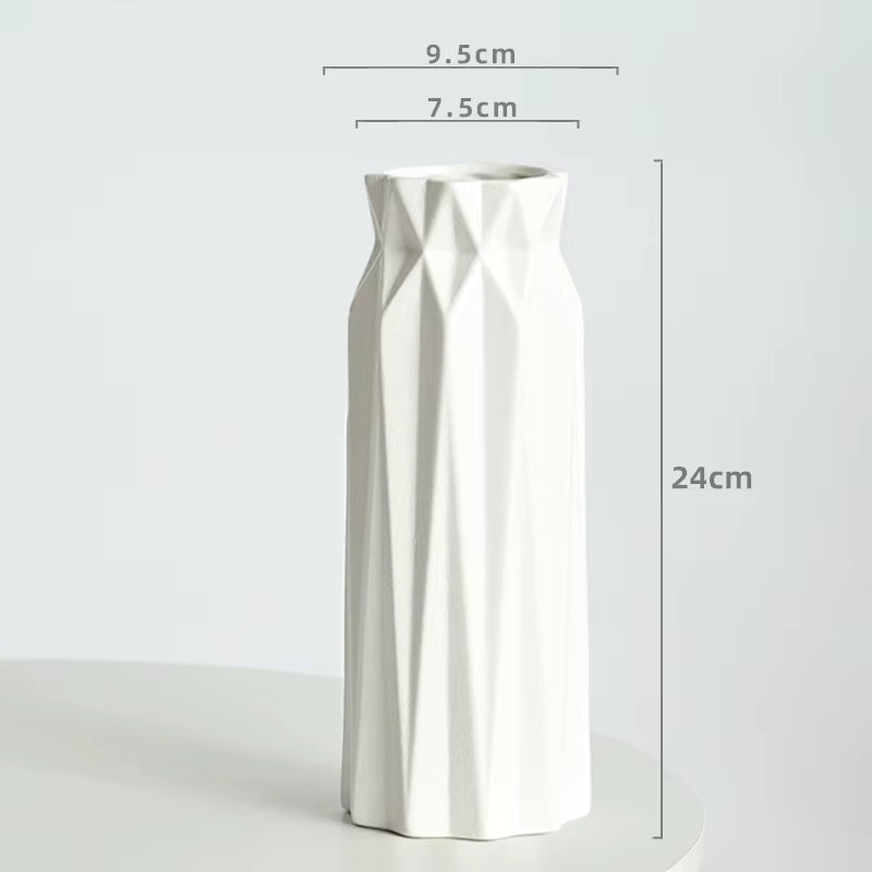 White geometric vase with dimensions on a light gray background