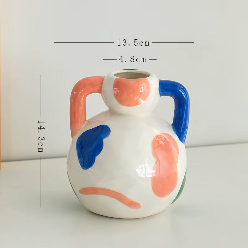 Ceramic vase with abstract design and measurements on a light background