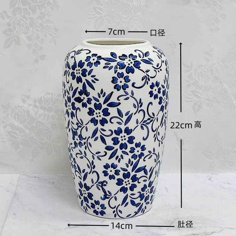Ceramic vase with blue floral patterns on a white background