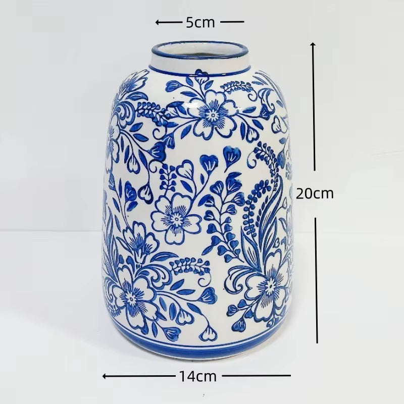 Ceramic vase with blue floral patterns and measurements on a white background