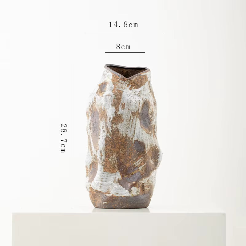 Ceramic vase with measurement details on a white background