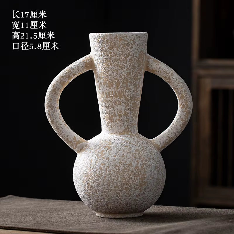 Decorative vase with handles on a dark background