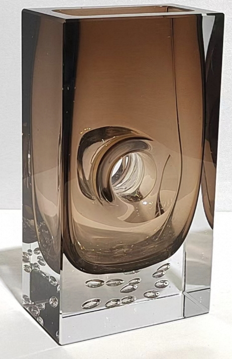 Decorative glass vase with a brown and clear design on a white background