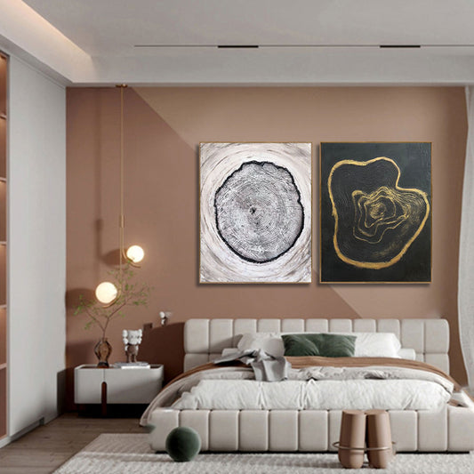 Modern bedroom with abstract wall art and a bed.