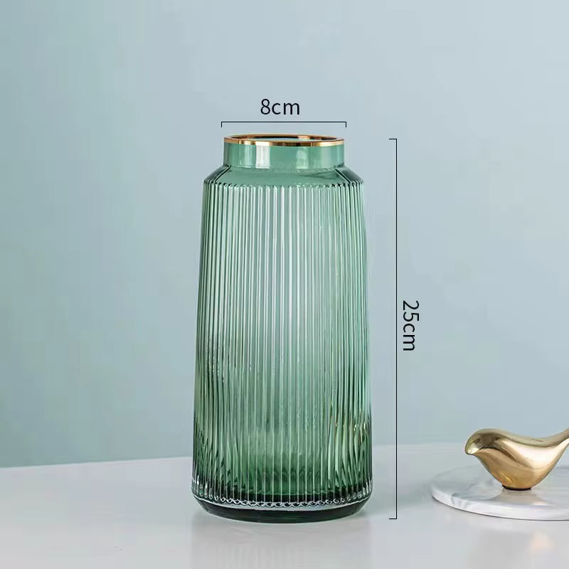 Green ribbed vase with gold rim and measurements on a light gray background