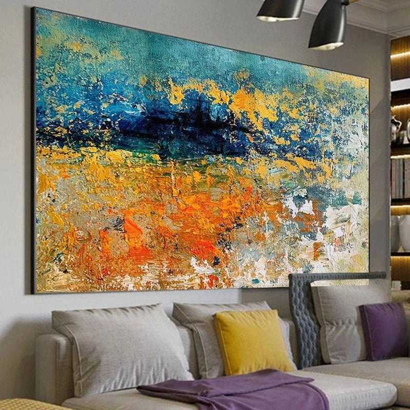 Abstract painting in a living room with a sofa and colorful pillows.