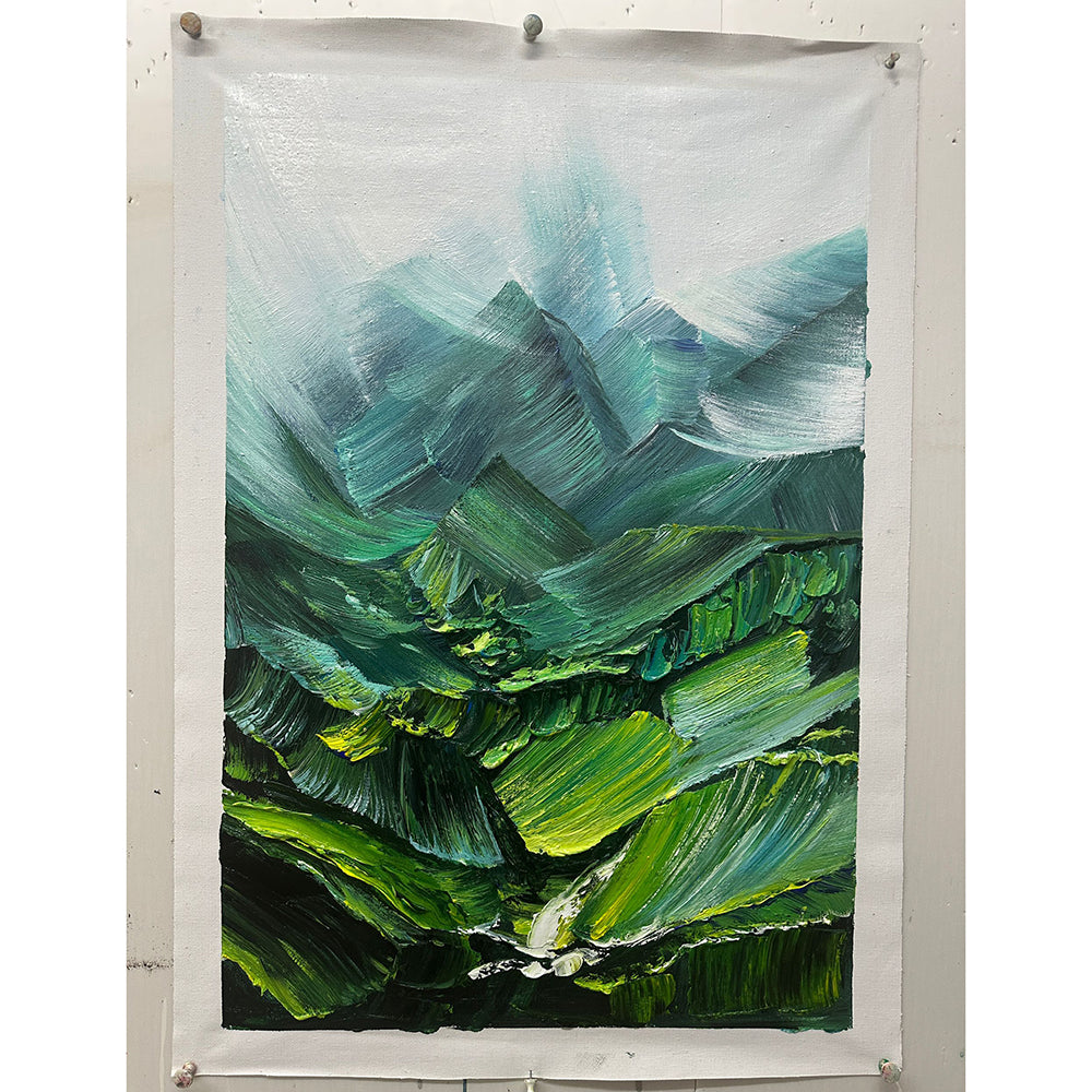 Painting of green mountains on a white wall