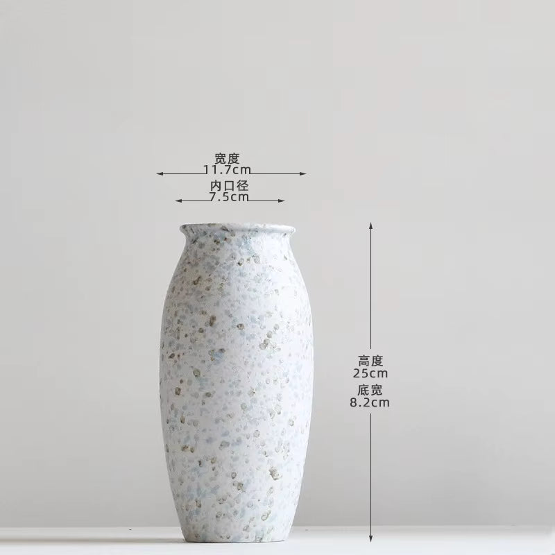 Decorative vase with measurements on a plain background