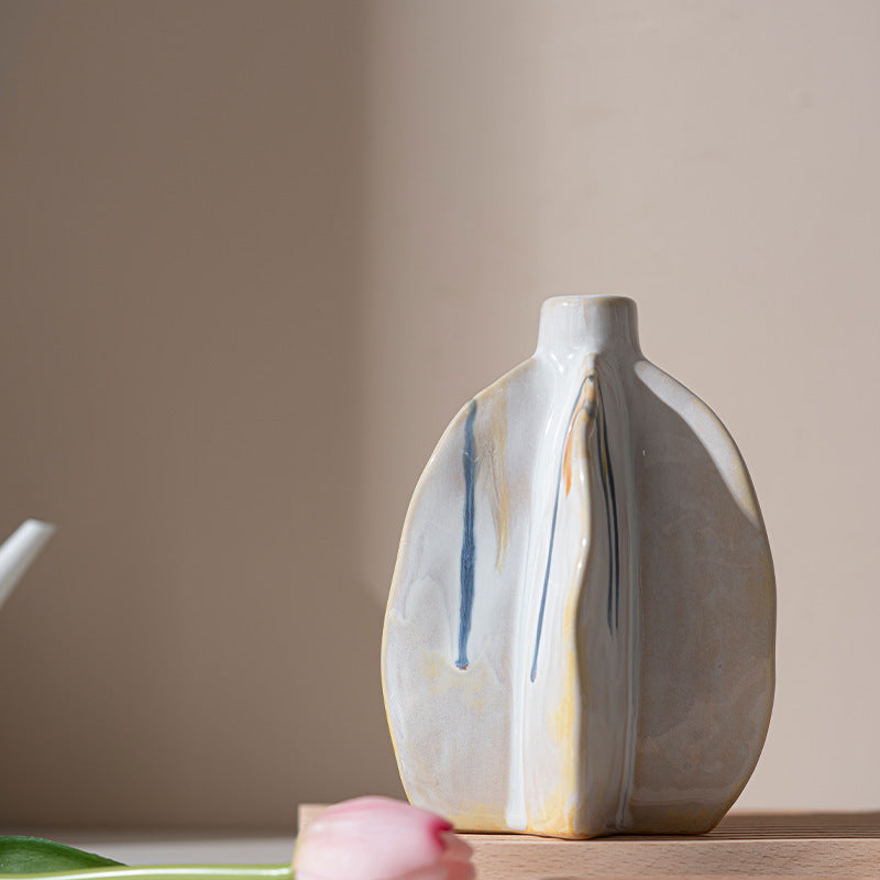 Ceramic vase with abstract design on a neutral background