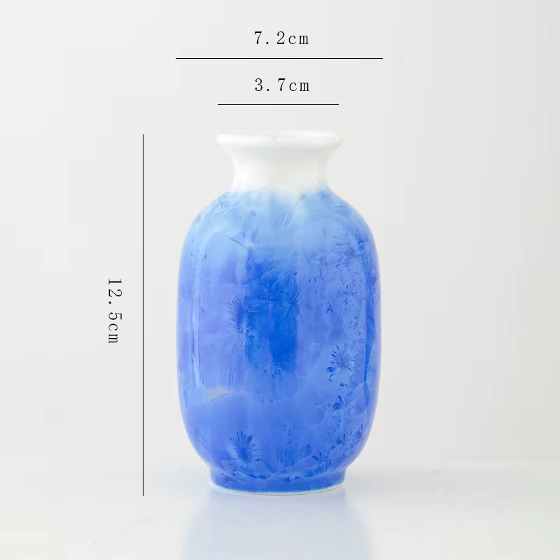 Blue vase with measurements on a white background