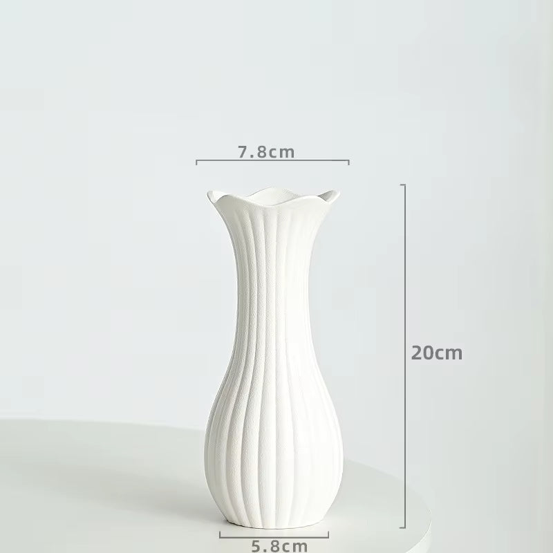White vase with dimensions indicated on a white background