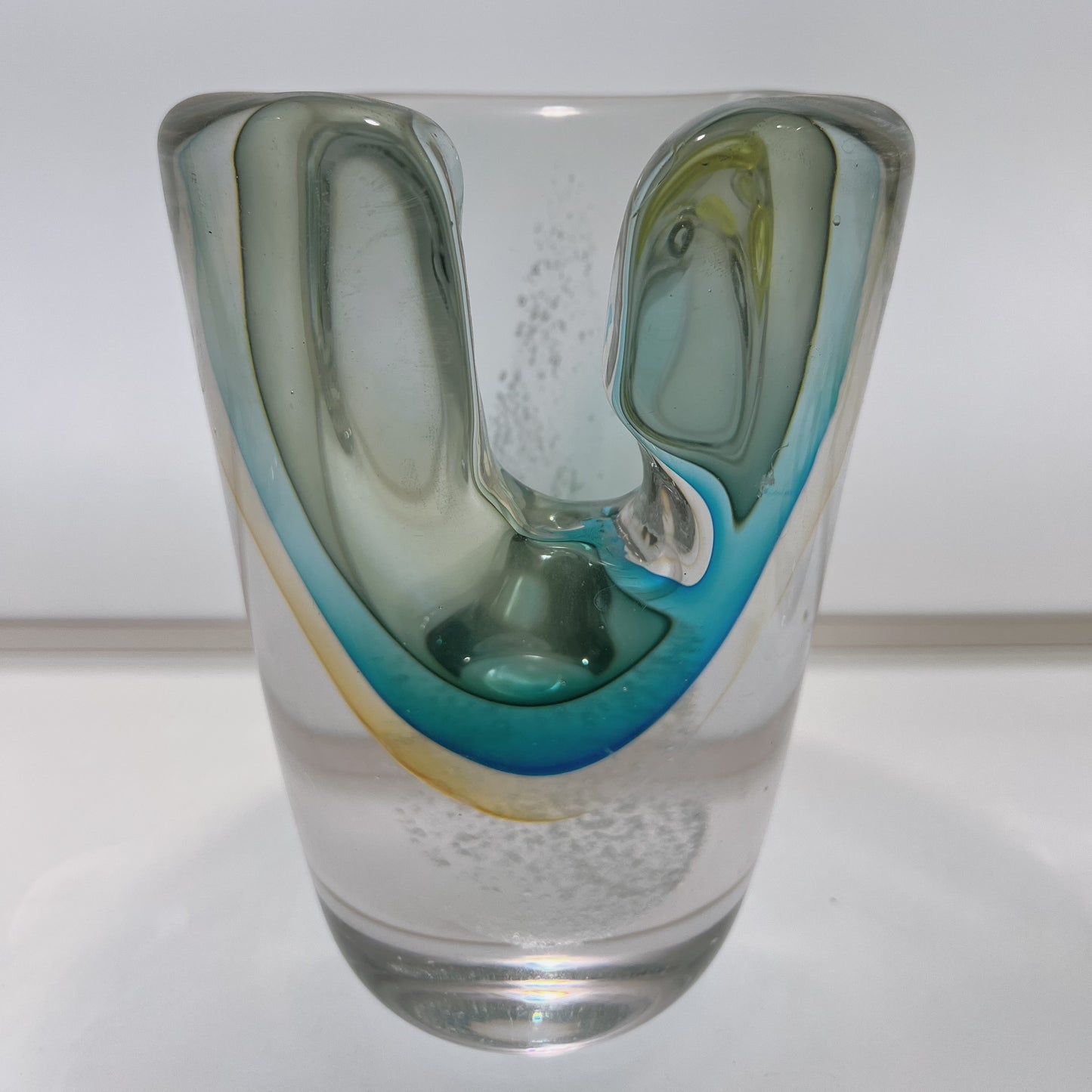 Glass vase with artistic design on a white background