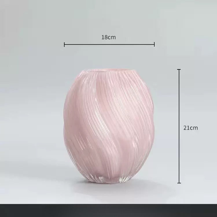 Pink glass vase with dimensions on a light gray background
