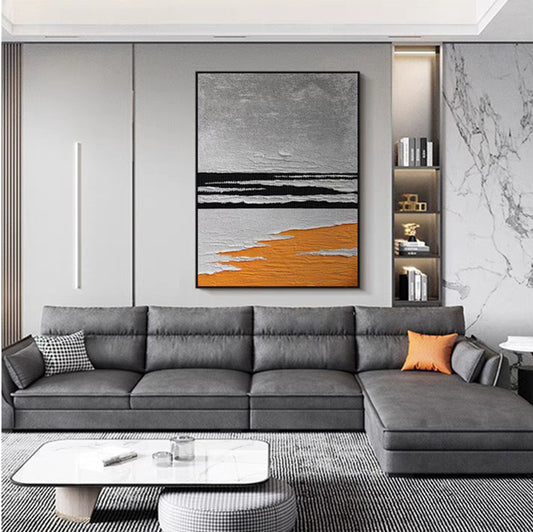 Modern living room with a gray sectional sofa, abstract painting, and decorative items.