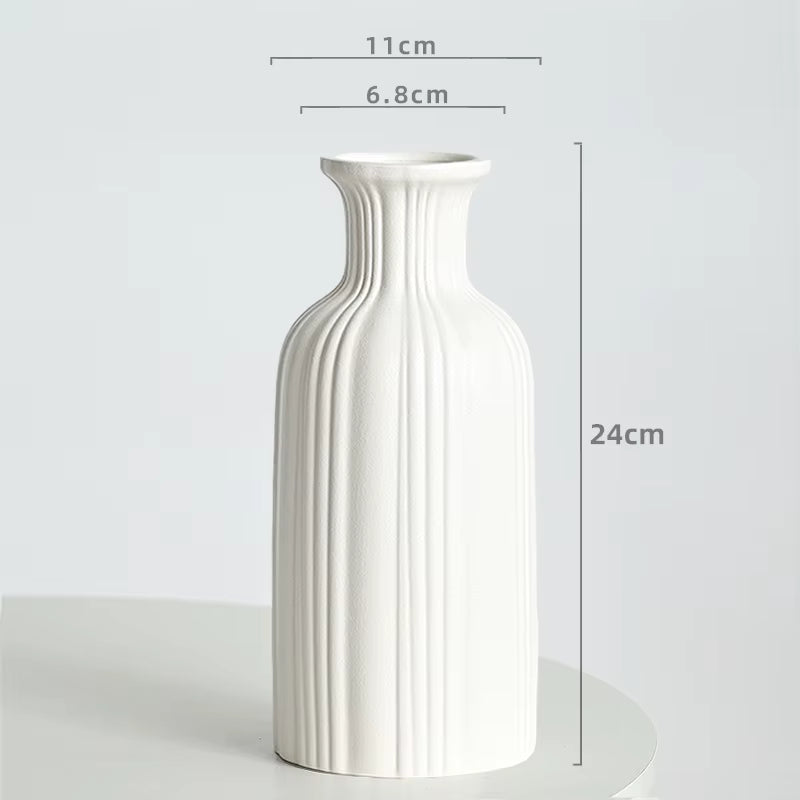 White vase with dimensions labeled on a light gray background