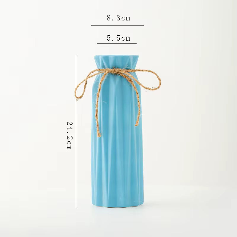 Blue bottle-shaped pouch with twine measurement details on a white background