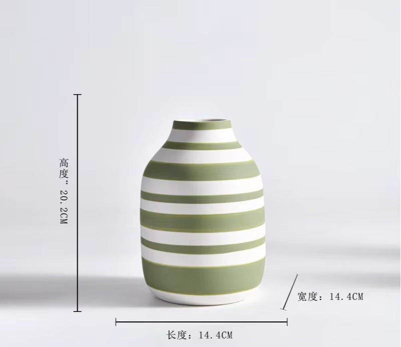 Green and white striped vase with dimensions on a light gray background