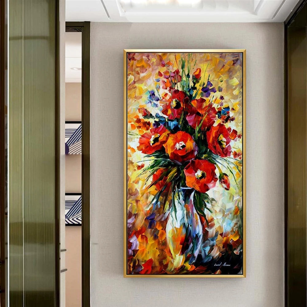 Colorful floral painting in a gold frame on a wall