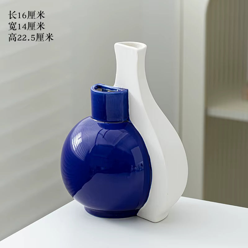 Blue and white ceramic vases on a light gray background