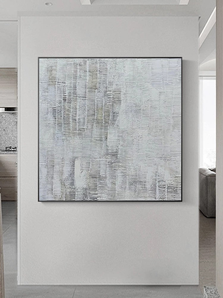 Abstract art piece on a white wall in a modern interior setting