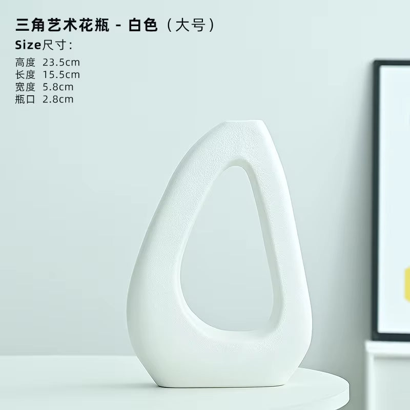 White artistic vase on a light gray background with product dimensions displayed.