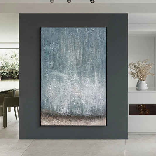 Abstract painting on a dark gray wall in a modern interior setting.