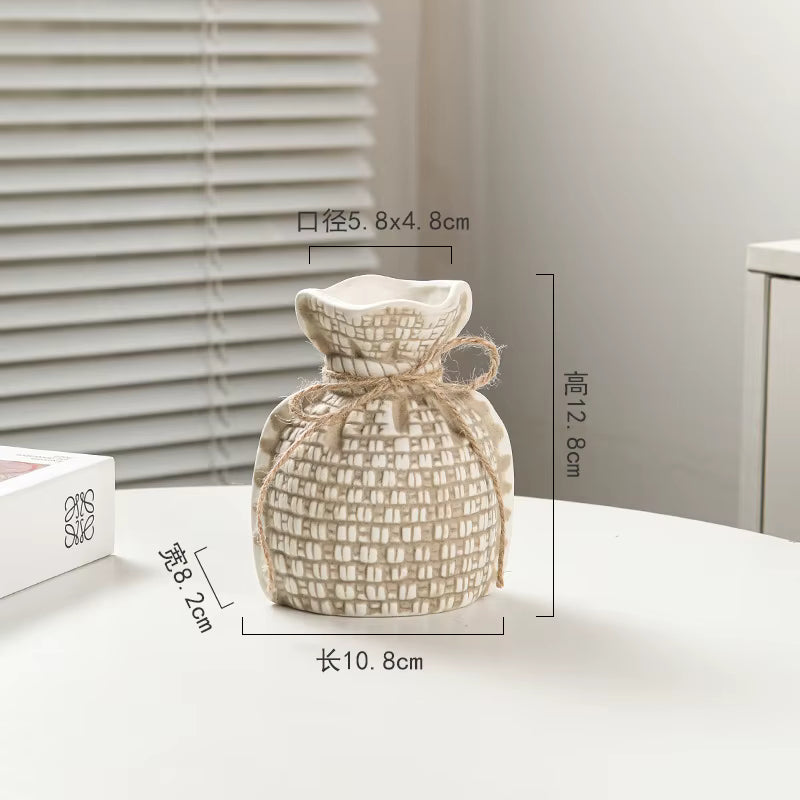 Woven decorative item with dimensions on a neutral background