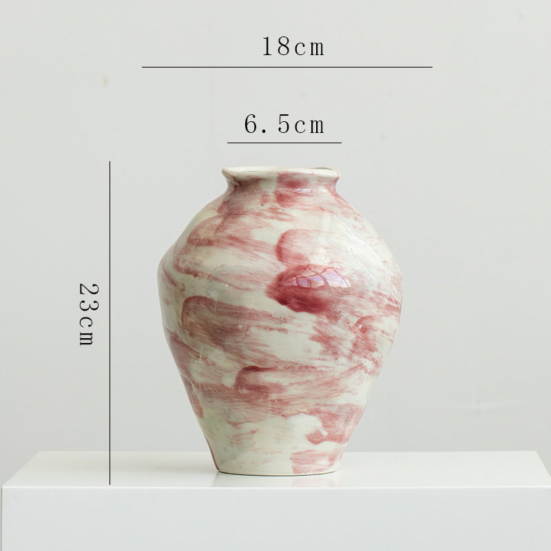 Marble-patterned vase with dimensions on a white background