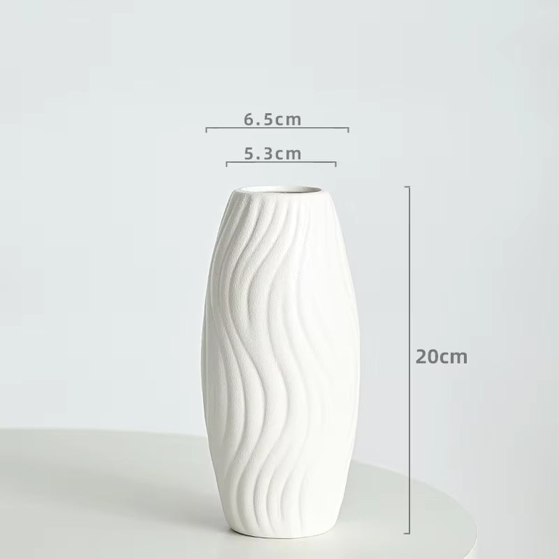 White ceramic vase with measurements on a light gray background