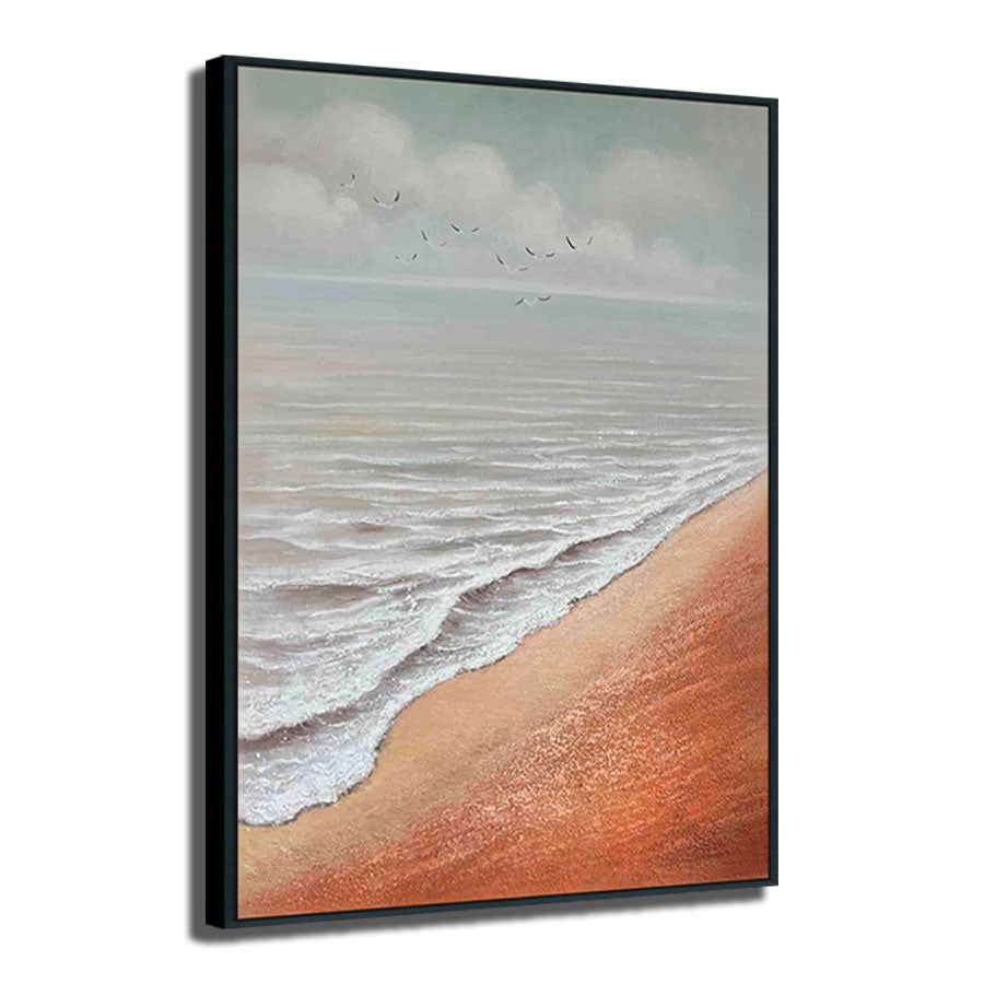 Framed artwork of a beach scene with waves and sky.