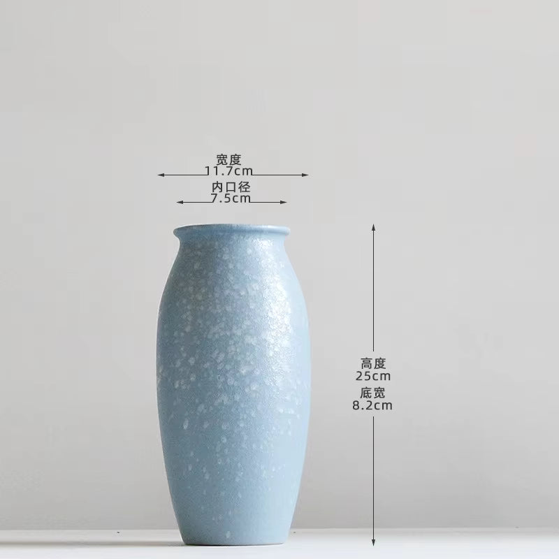Blue ceramic vase with dimensions on a white background
