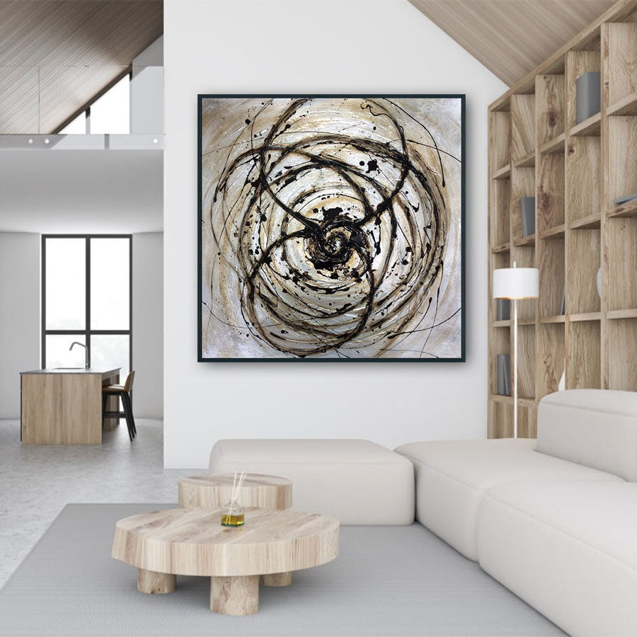 Modern living room with abstract artwork on the wall and wooden coffee table.