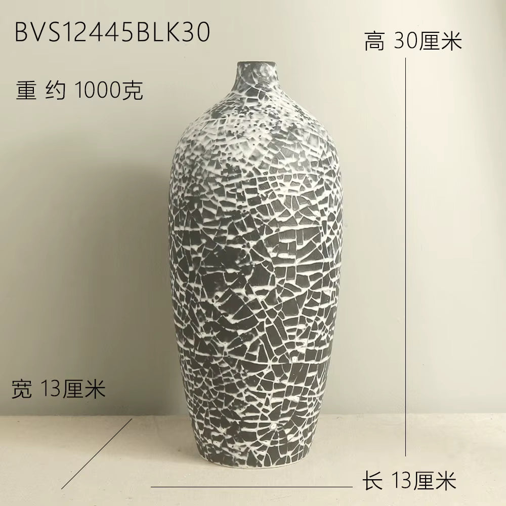 Decorative vase with mosaic pattern on a plain background