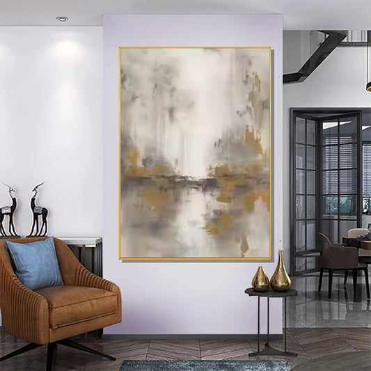 Abstract painting in a modern living room setting with a brown armchair and decorative items.