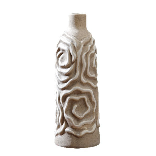 Decorative ceramic vase with textured design on a white background