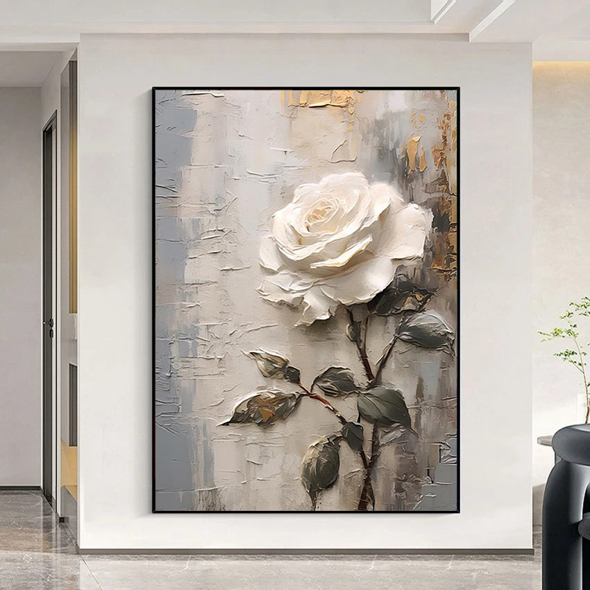 Framed painting of a white rose on a textured background in a modern interior setting.