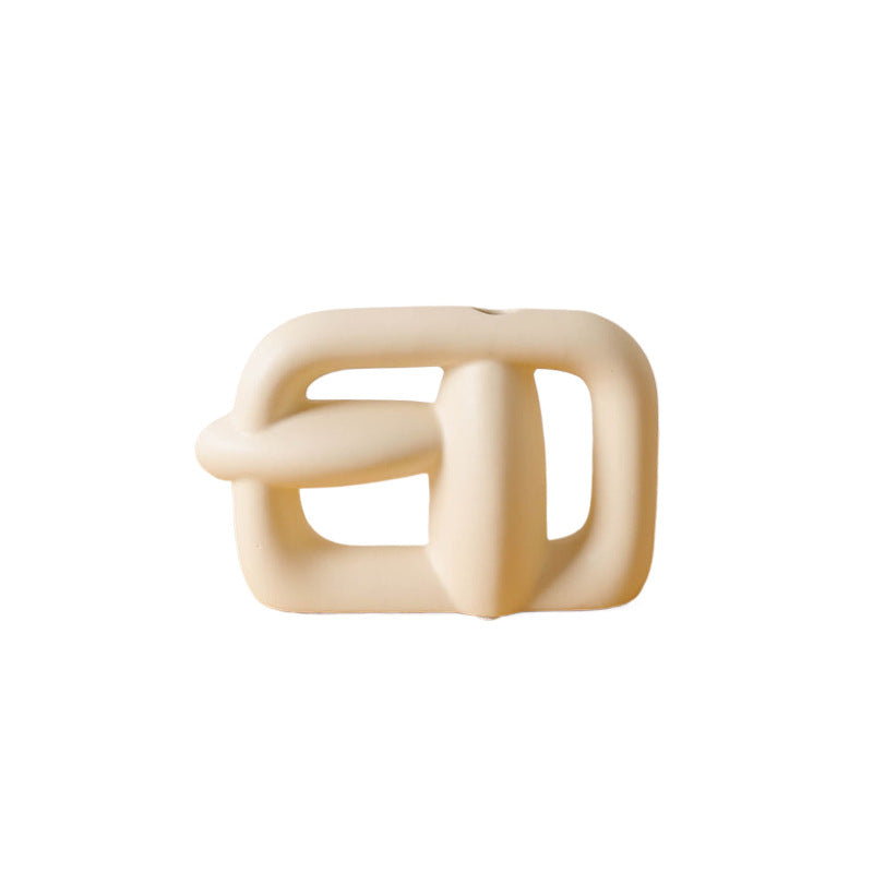 Beige ceramic square-shaped object on a white background