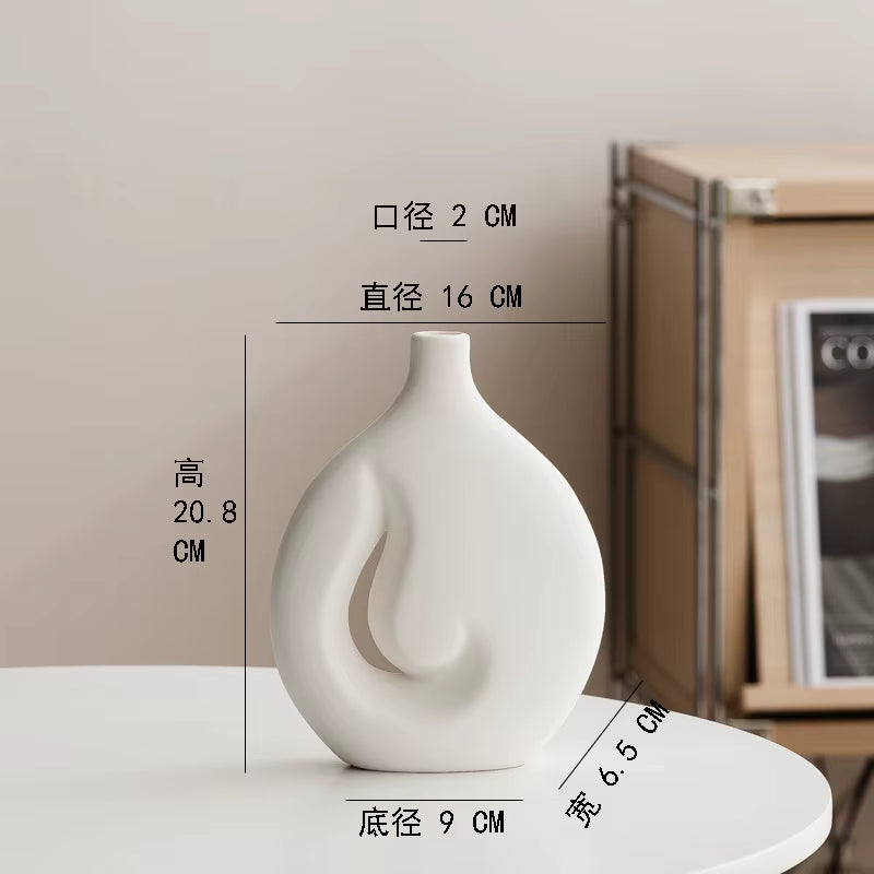 White vase with dimensions labeled on a neutral background